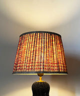 Black Wicker Table Lamp with Pleated Red Print Shade