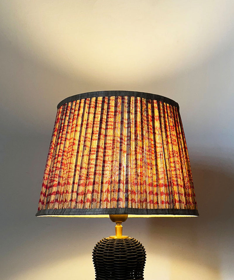 Black Wicker Table Lamp with Pleated Red Print Shade
