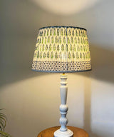 White Spindle Table Lamp with Green Floral Pleated Shade